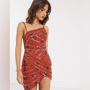 ASOS DESIGN asymmetric gel-tribal embellishment mini dress with wrap skirt